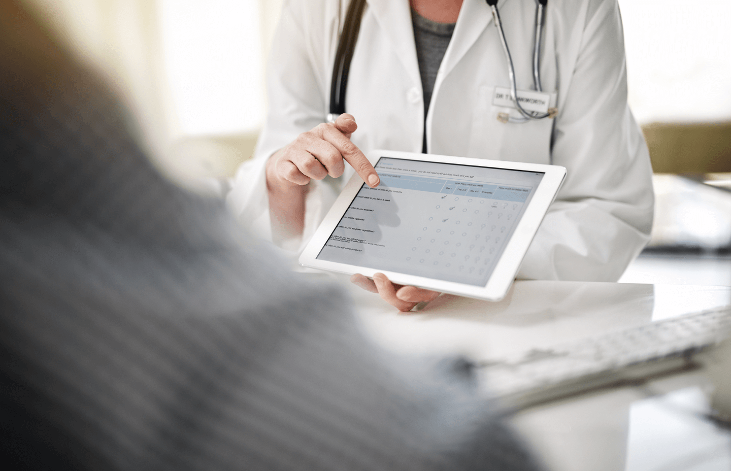 Doctor holding device with online patient intake form